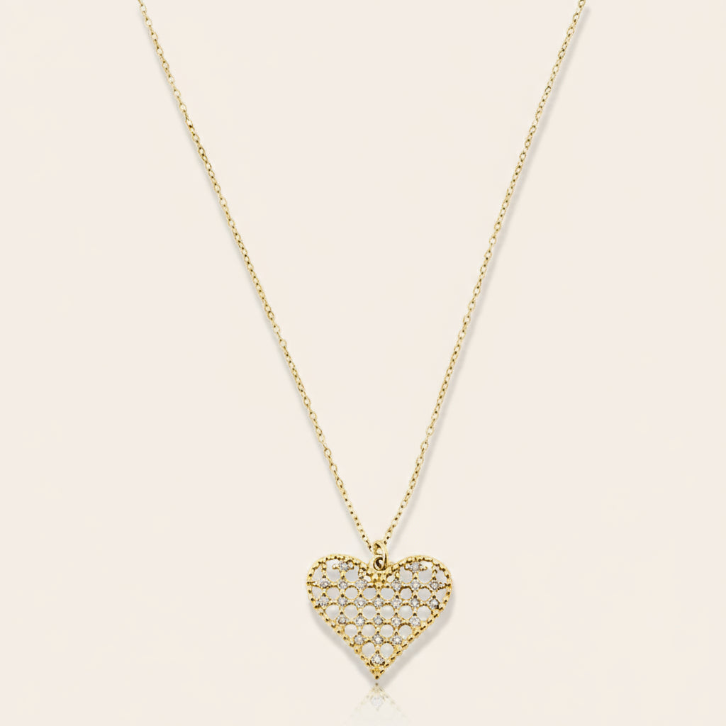 A delicate gold necklace with a heart-shaped pendant featuring small diamonds.