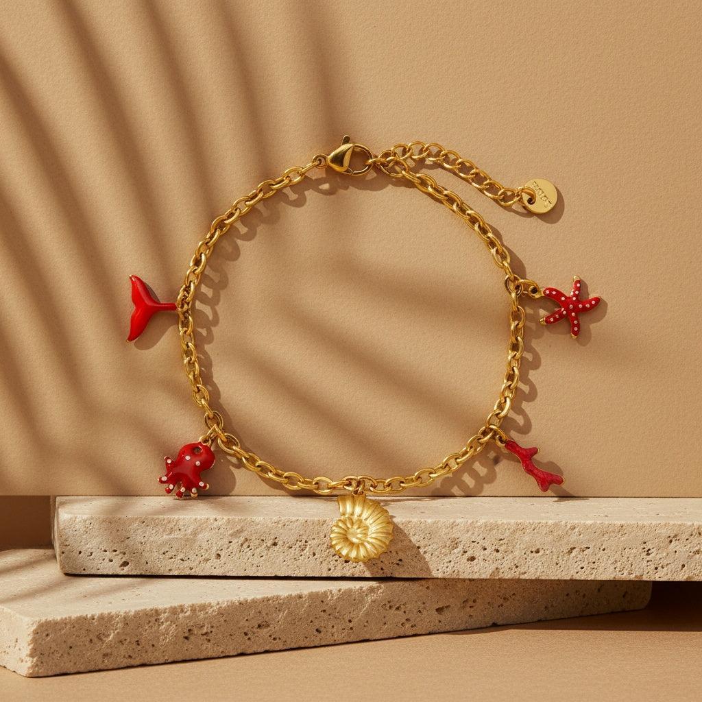 „Aquilea“ – Edelstahl-Arm­kette mit Meer-Charms, 17 cm + 3 cm