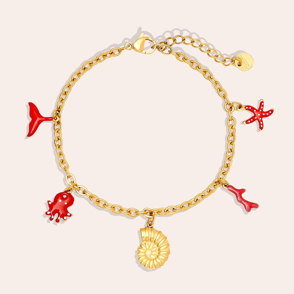 „Aquilea“ – Edelstahl-Arm­kette mit Meer-Charms, 17 cm + 3 cm-Goldharmonie