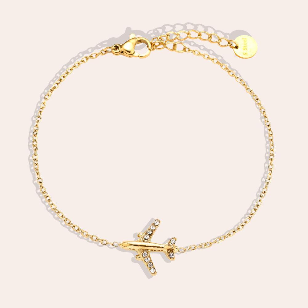 „Avyelle“ – Edelstahl-Arm­kette mit Zirkonia-Flugzeuganhänger, 17 cm + 3 cm-Goldharmonie