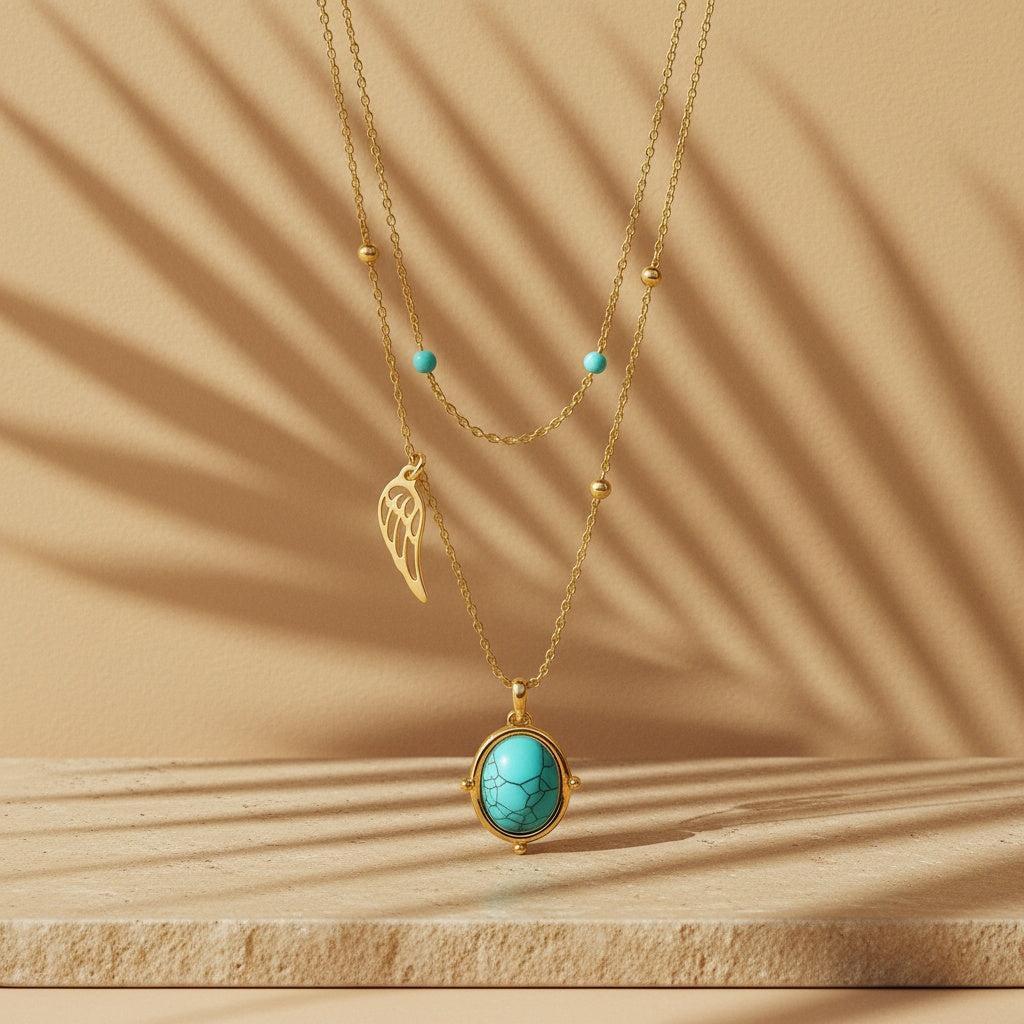 "Ayora" – Layeringkette in Goldfarbe mit Türkis-Naturstein & Flügelanhänger
