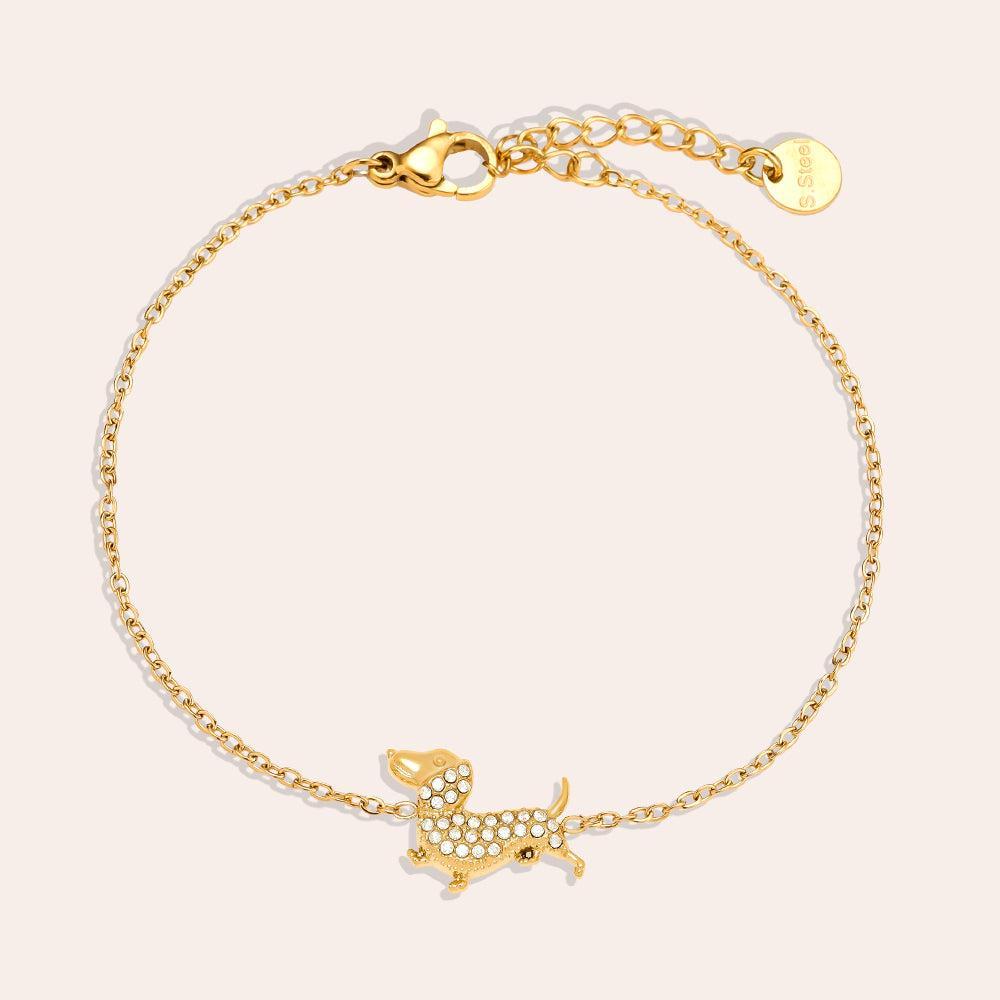 „Canella“ – Edelstahl-Arm­kette mit Zirkonia-Hundecharm, 17 cm + 3 cm-Goldharmonie