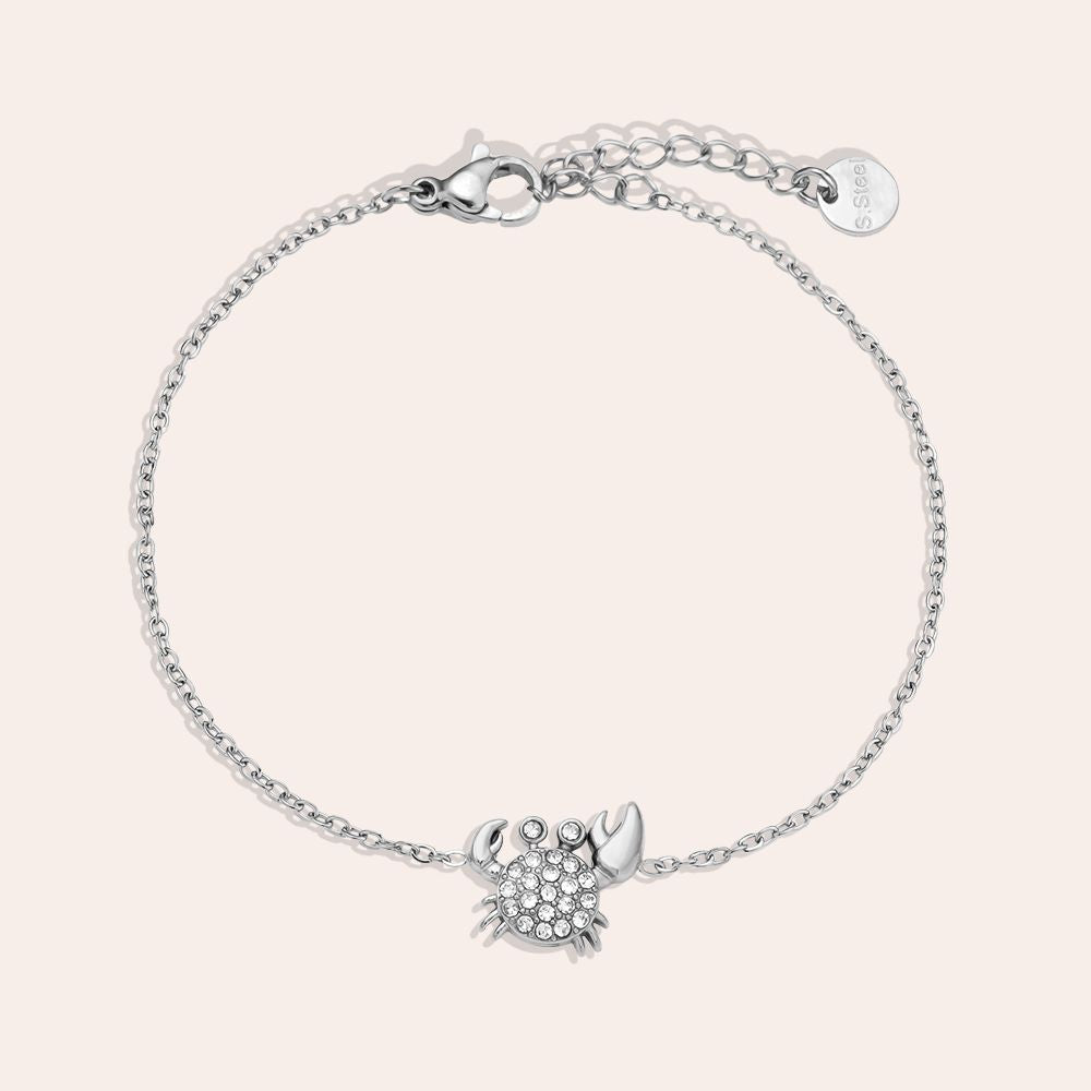 „Crilaya“ – Edelstahl-Arm­kette mit Zirkonia-Krabben-Charm, 17 cm + 3 cm