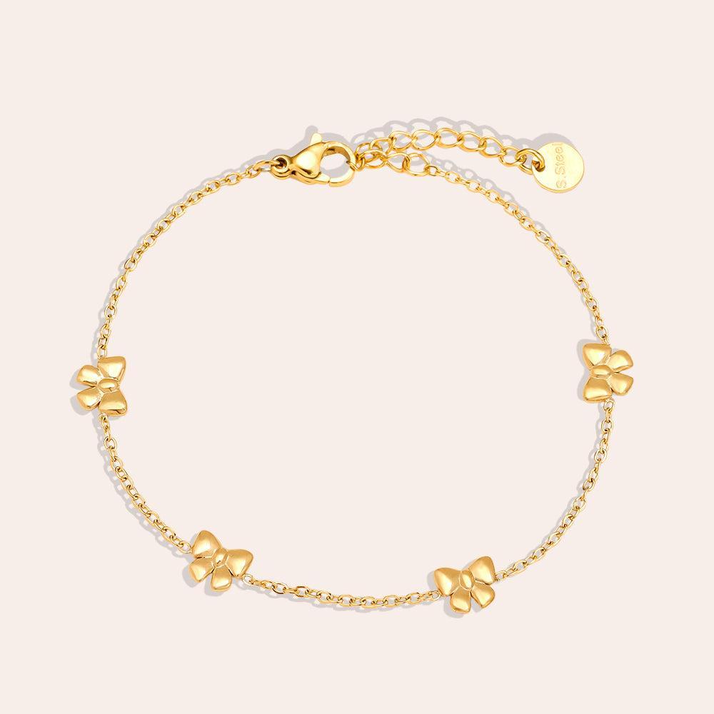„Evelira“ – Zarte Edelstahlarmkette mit Schleifenakzent-Goldharmonie
