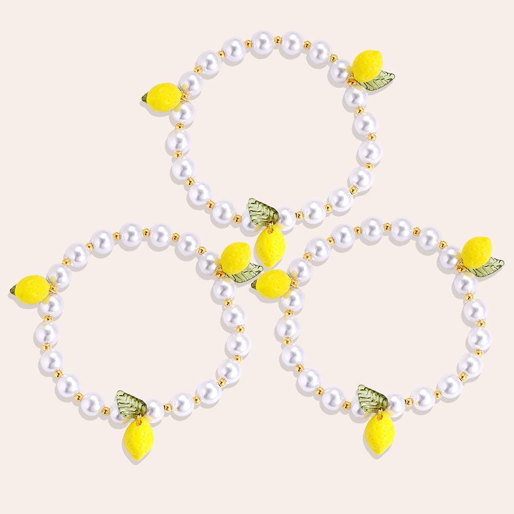 „Limoria“ – 3-teiliges Edelstahl-Armbandset mit Zitronen-Charm & Glasperlen, 17 cm + 3 cm-Goldharmonie