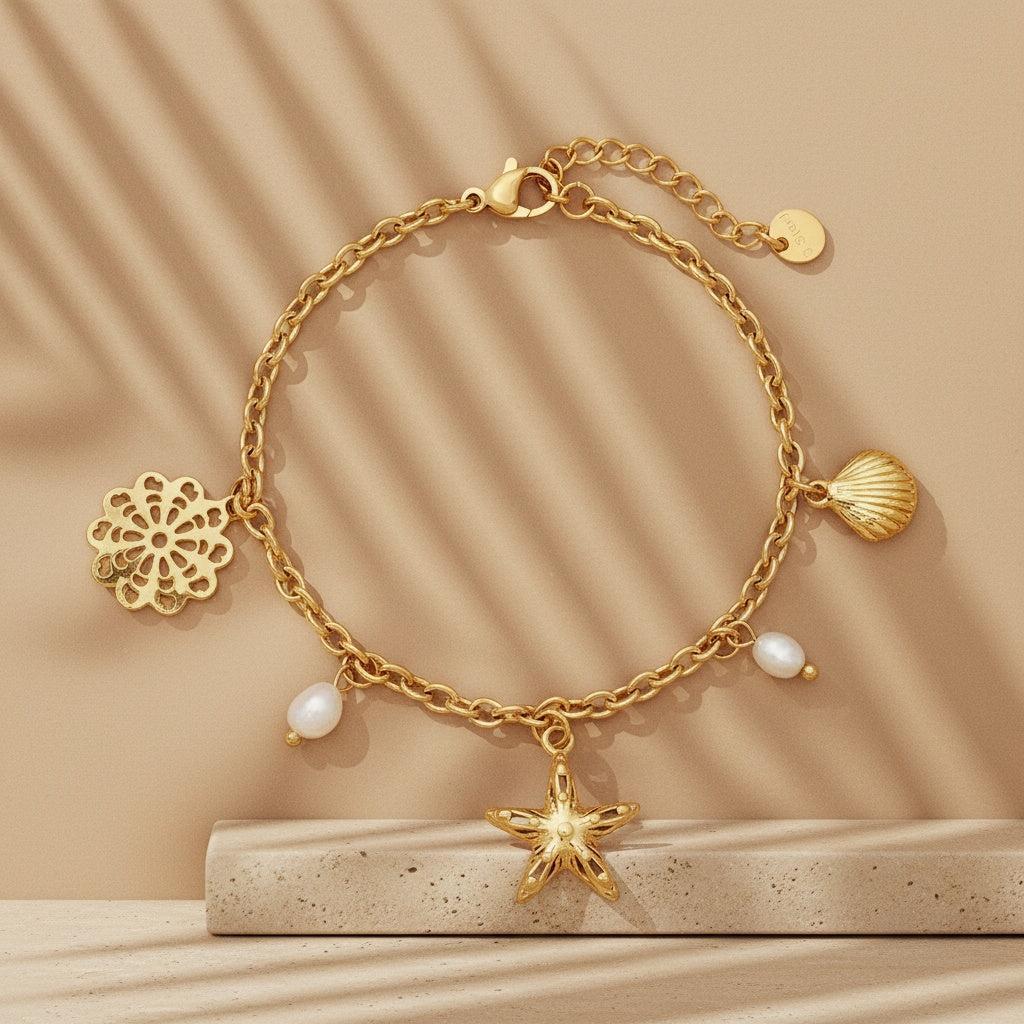 „Mareli“ – Edelstahl-Arm­kette mit Süßwasserperle & Meeres-Charms, 17 cm + 3 cm