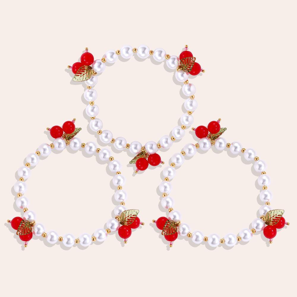 „Mirabellé“ – 3-teiliges Edelstahl-Armbandset mit roten Frucht-Charms, 17 cm-Goldharmonie
