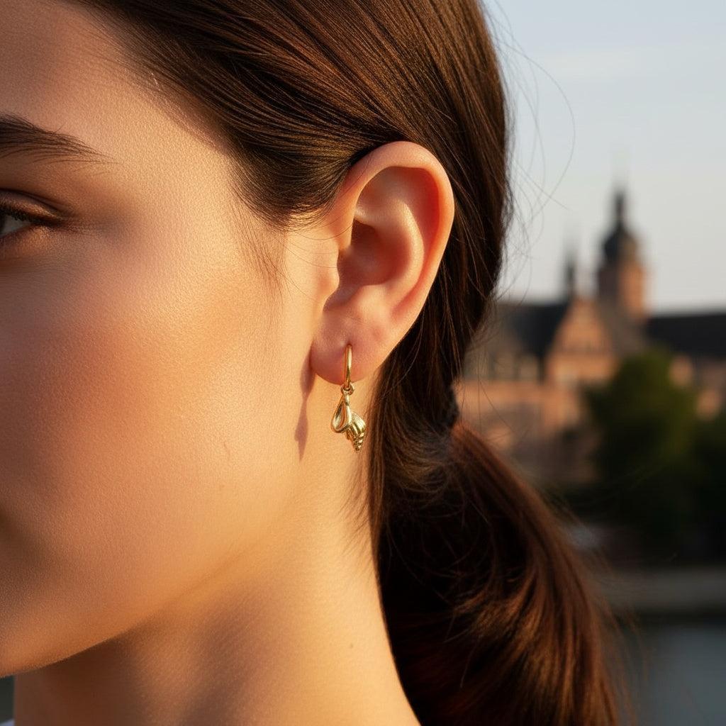 „Savitara“ Conch Ohrringe