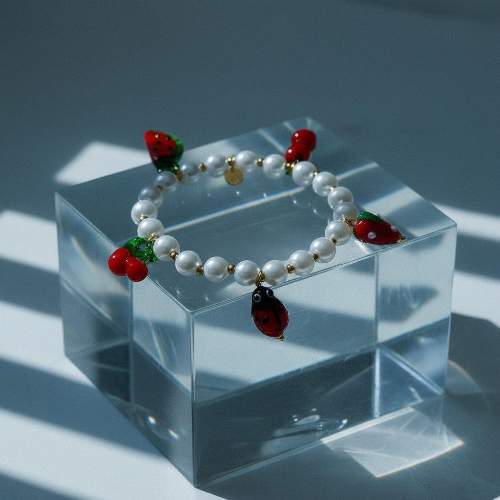 „Solariva“ Fruit In Pearl Chain Armband
